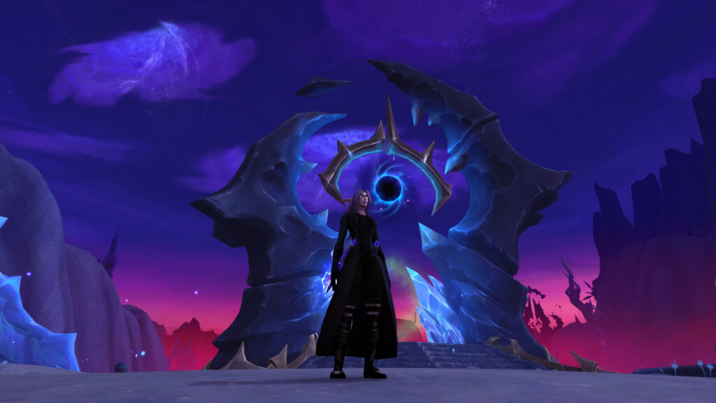 A lone figure standing before a glowing portal